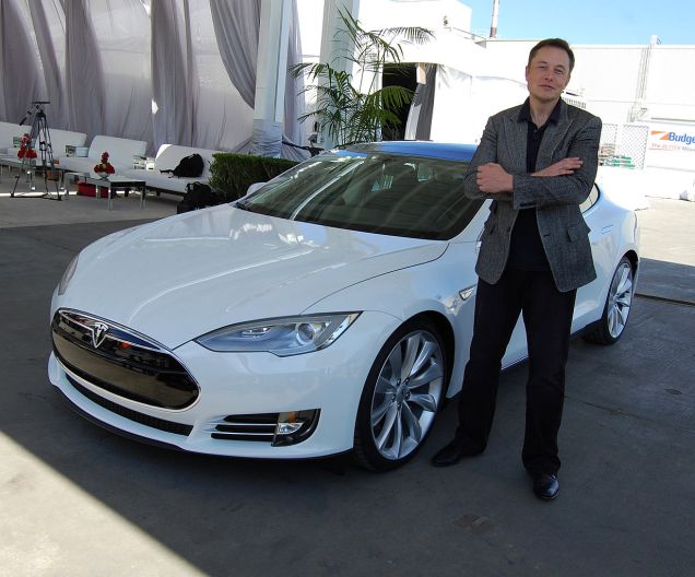 Elon Musk with a Tesla Car